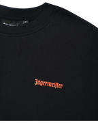 Zwart T-shirt met oranje Jägermeister-logo op de borst.