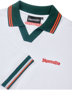 White Jägermeister polo shirt with green collar and orange trim featuring orange Jägermeister branding.