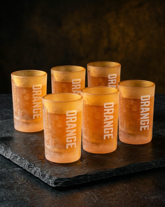 Set of six Jägermeister orange glasses with 'ORANGE' text