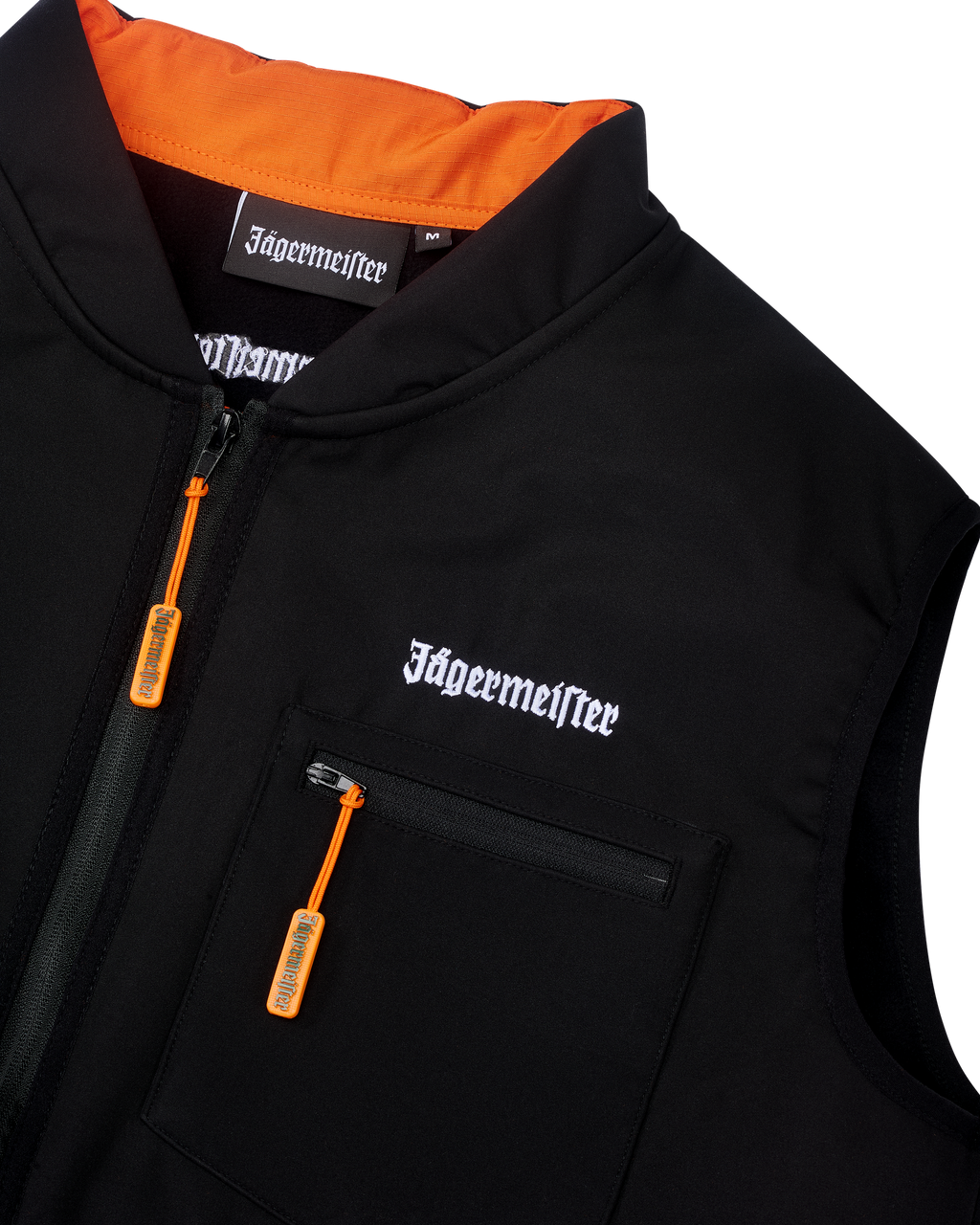 Zwarte Jägermeister-tactische vest met witte Jägermeister-wordmark-branding en een oranje rits.