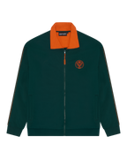 Groen Jägermeister trainingsjack met oranje kraag en oranje Jägermeister-logo op de borst.
